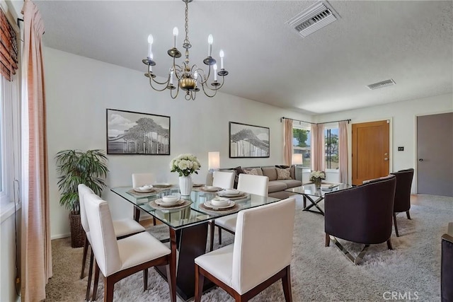 436 W Porter Ave, Fullerton, CA 92832 - carpeted dining space featuring a chandelier and a textured ceiling