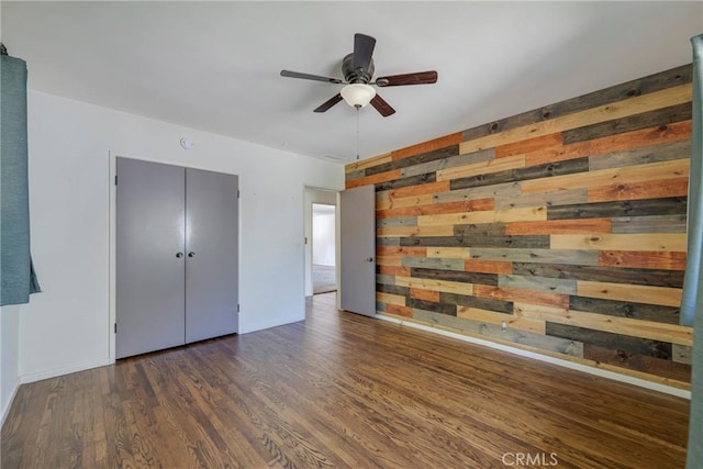 436 W Porter Ave, Fullerton, CA 92832 - unfurnished bedroom featuring wooden walls, wood finished floors, baseboards, and ceiling fan