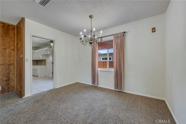 436 W Porter Ave, Fullerton, CA 92832 - carpeted spare room featuring a chandelier, baseboards, a textured ceiling, and ceiling fan