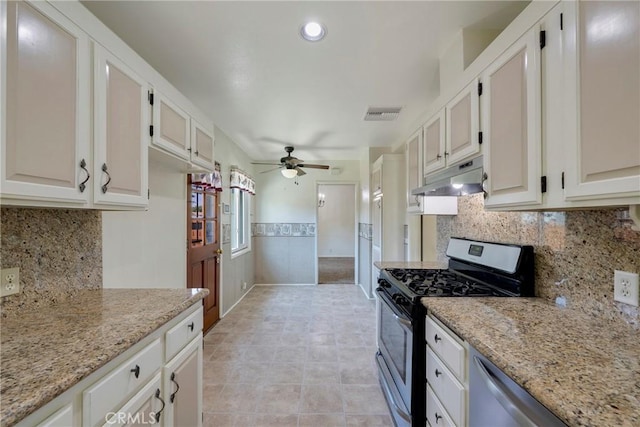 436 W Porter Ave, Fullerton, CA 92832 - kitchen featuring stainless steel appliances, under cabinet range hood, a ceiling fan, light stone counters, and a wainscoted wall