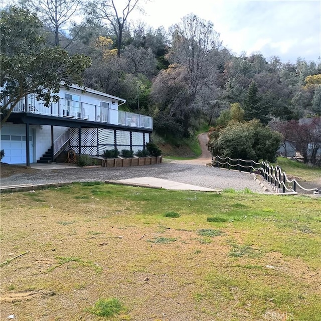 10098 Crestview Dr, Clearlake, CA 95424 - view of green lawn featuring stairs and a wooden deck