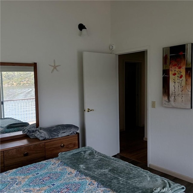 10098 Crestview Dr, Clearlake, CA 95424 - bedroom featuring wood finished floors and a high ceiling