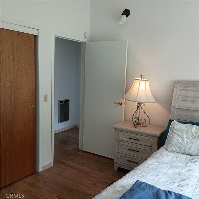 10098 Crestview Dr, Clearlake, CA 95424 - bedroom featuring heating unit and wood finished floors