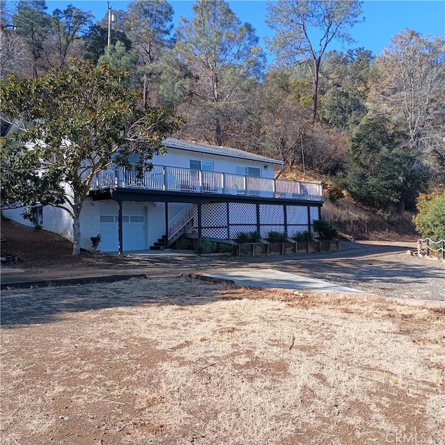 10098 Crestview Dr, Clearlake, CA 95424 - view of front of house featuring a wooden deck and stairway
