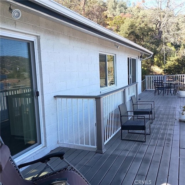 10098 Crestview Dr, Clearlake, CA 95424 - wooden terrace featuring outdoor dining space