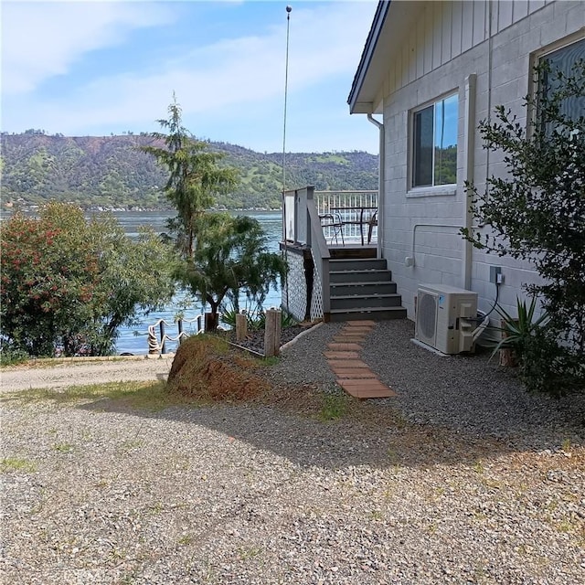 10098 Crestview Dr, Clearlake, CA 95424 - view of property exterior with a water view and concrete block siding