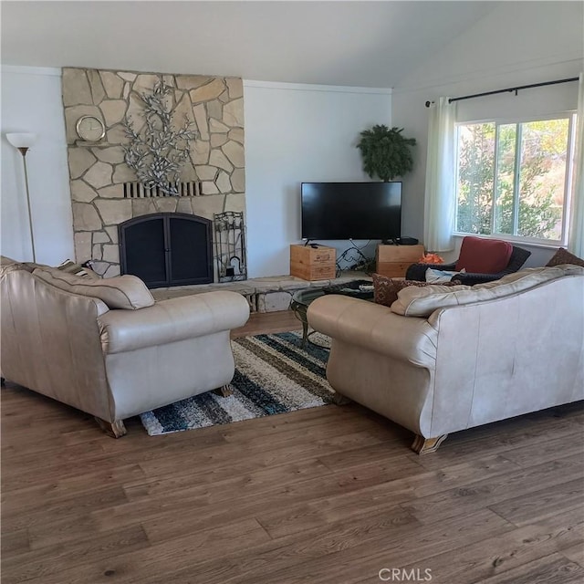 10098 Crestview Dr, Clearlake, CA 95424 - living area with lofted ceiling, wood finished floors, crown molding, and a stone fireplace
