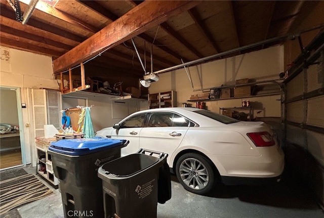 161 Janet Ave, Grover Beach, CA 93433 - garage with a garage door opener and concrete block wall