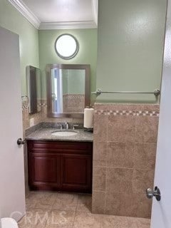 13905 Magnolia St, Garden Grove, CA 92844 - bathroom featuring ornamental molding, vanity, tile patterned floors, and tile walls