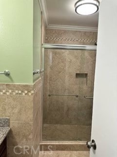 13905 Magnolia St, Garden Grove, CA 92844 - full bath with vanity, a shower stall, tile walls, crown molding, and a wainscoted wall