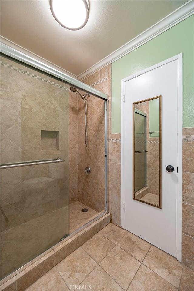 13905 Magnolia St, Garden Grove, CA 92844 - full bathroom featuring ornamental molding, a shower stall, tile patterned flooring, and tile walls