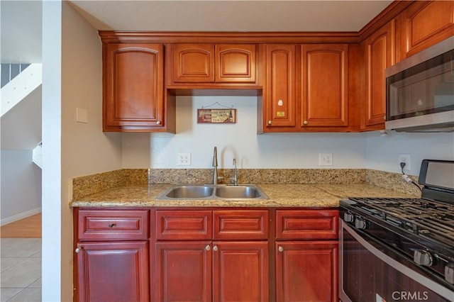 13905 Magnolia St, Garden Grove, CA 92844 - kitchen featuring stainless steel appliances, light tile patterned floors, light stone countertops, and dark brown cabinets