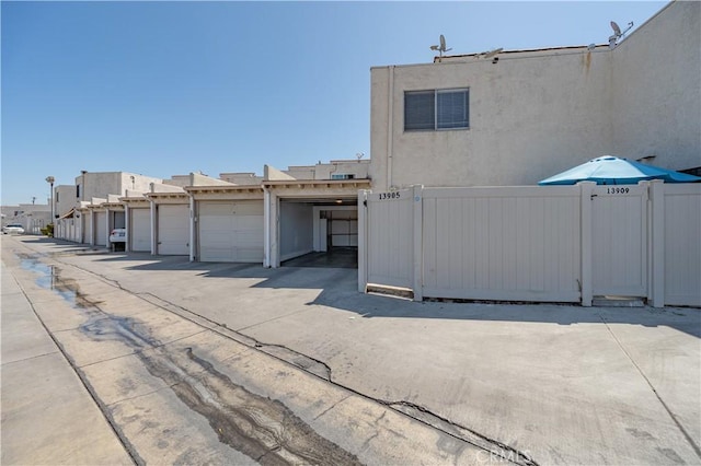 13905 Magnolia St, Garden Grove, CA 92844 - view of property exterior featuring stucco siding and community garages