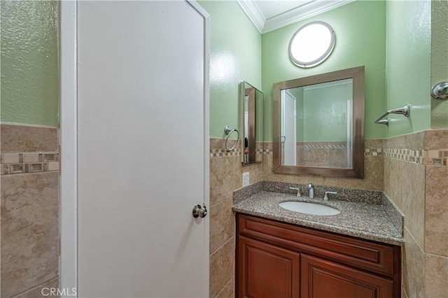 13905 Magnolia St, Garden Grove, CA 92844 - bathroom featuring tile walls, ornamental molding, vanity, and wainscoting