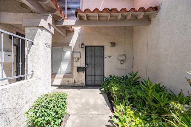 13905 Magnolia St, Garden Grove, CA 92844 - property entrance featuring stucco siding and a tile roof
