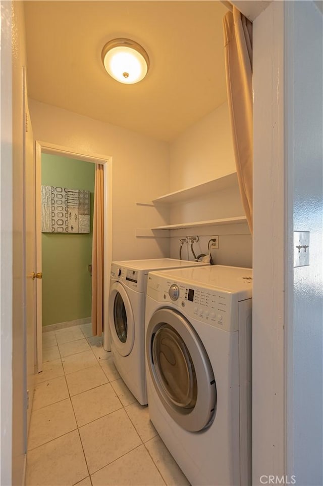 13905 Magnolia St, Garden Grove, CA 92844 - washroom with washing machine and dryer and light tile patterned floors