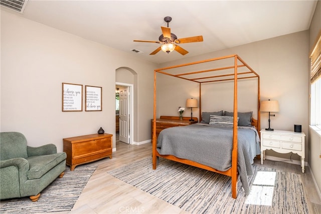 23840 Costa Mesa Way, Murrieta, CA 92562 - bedroom with arched walkways, wood finished floors, baseboards, and a ceiling fan