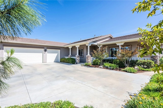 23840 Costa Mesa Way, Murrieta, CA 92562 - ranch-style home with stucco siding, a porch, concrete driveway, a garage, and stone siding