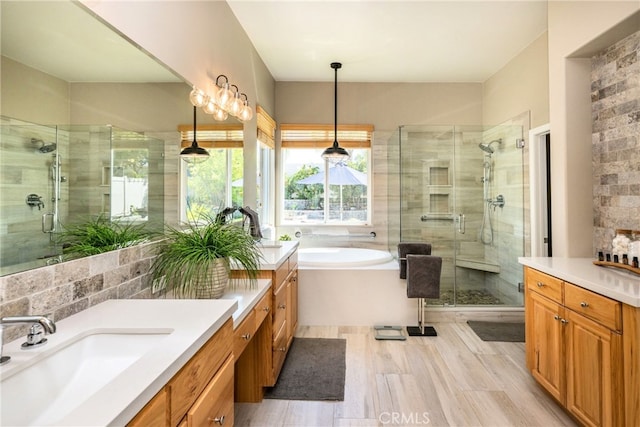23840 Costa Mesa Way, Murrieta, CA 92562 - bathroom featuring a shower stall, vanity, a garden tub, wood finished floors, and backsplash