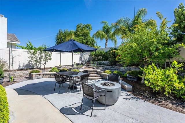 23840 Costa Mesa Way, Murrieta, CA 92562 - view of patio / terrace with a fire pit and outdoor dining area