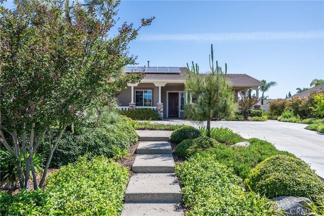 23840 Costa Mesa Way, Murrieta, CA 92562 - view of front of home featuring a porch, solar panels, and stucco siding