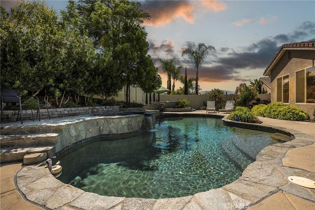 23840 Costa Mesa Way, Murrieta, CA 92562 - pool at dusk featuring a pool with connected hot tub, a fenced backyard, and a patio