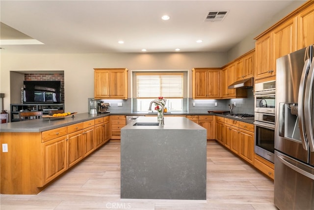 23840 Costa Mesa Way, Murrieta, CA 92562 - kitchen with stainless steel appliances, a kitchen island, a peninsula, tasteful backsplash, and recessed lighting
