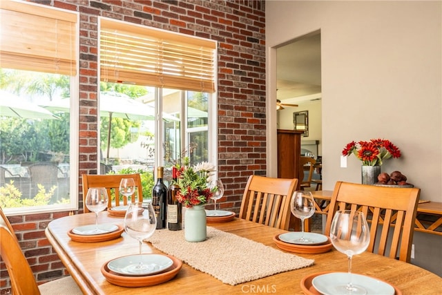 23840 Costa Mesa Way, Murrieta, CA 92562 - dining area featuring a ceiling fan, wood finished floors, and brick wall