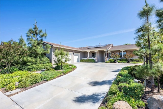 23840 Costa Mesa Way, Murrieta, CA 92562 - ranch-style home featuring an attached garage, roof mounted solar panels, stucco siding, and concrete driveway