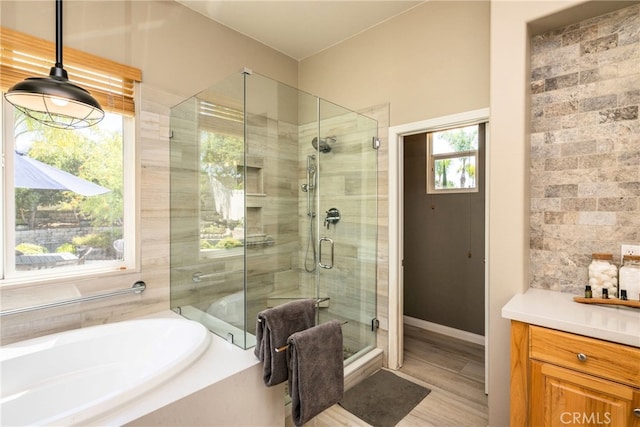 23840 Costa Mesa Way, Murrieta, CA 92562 - full bathroom with a stall shower, a bath, vanity, and wood finished floors