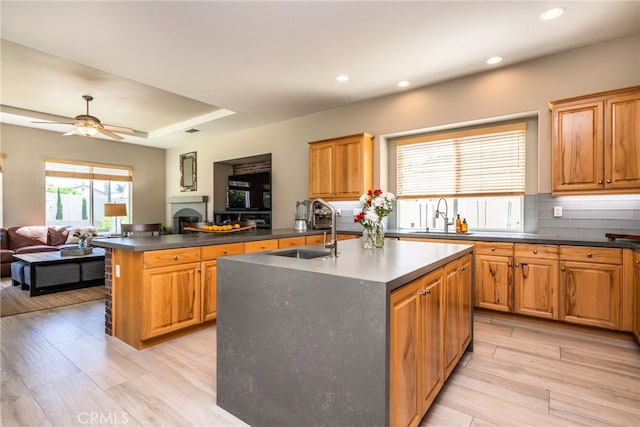 23840 Costa Mesa Way, Murrieta, CA 92562 - kitchen featuring open floor plan, a sink, dark countertops, light wood-type flooring, and recessed lighting