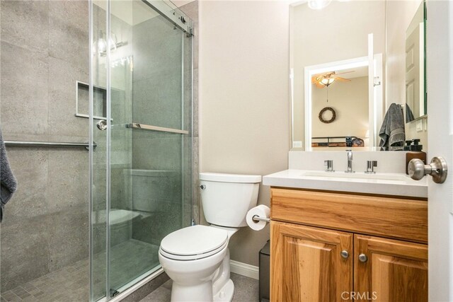 23840 Costa Mesa Way, Murrieta, CA 92562 - full bathroom featuring toilet, vanity, a stall shower, and baseboards