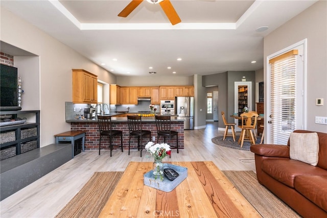 23840 Costa Mesa Way, Murrieta, CA 92562 - living room featuring light wood finished floors, a ceiling fan, and recessed lighting