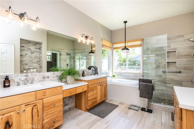 23840 Costa Mesa Way, Murrieta, CA 92562 - bathroom featuring a stall shower, vanity, a garden tub, wood finished floors, and decorative backsplash