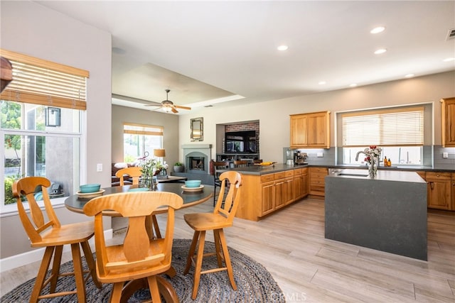 23840 Costa Mesa Way, Murrieta, CA 92562 - kitchen with a peninsula, a sink, light wood-type flooring, recessed lighting, and open floor plan