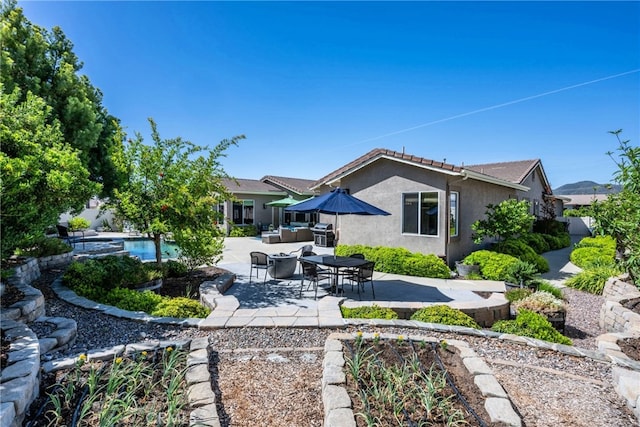 23840 Costa Mesa Way, Murrieta, CA 92562 - rear view of house featuring a patio, stucco siding, an outdoor living space, and a pool