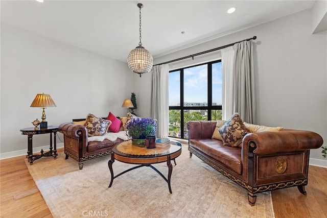 402 Rockefeller Unit 407, Irvine, CA 92612 - living area featuring light wood-style flooring, baseboards, recessed lighting, and a chandelier