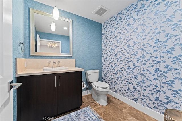 402 Rockefeller Unit 407, Irvine, CA 92612 - full bath featuring toilet, vanity, wallpapered walls, and baseboards