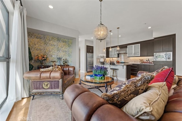 402 Rockefeller Unit 407, Irvine, CA 92612 - living area with light wood-style flooring, recessed lighting, and a chandelier