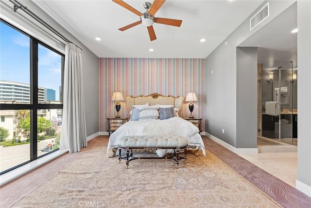 402 Rockefeller Unit 407, Irvine, CA 92612 - bedroom with wallpapered walls, baseboards, an accent wall, recessed lighting, and connected bathroom