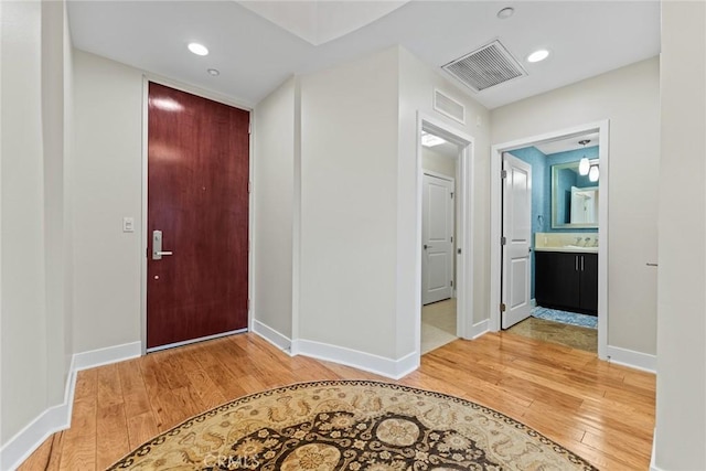 402 Rockefeller Unit 407, Irvine, CA 92612 - foyer entrance with light wood finished floors, baseboards, and recessed lighting