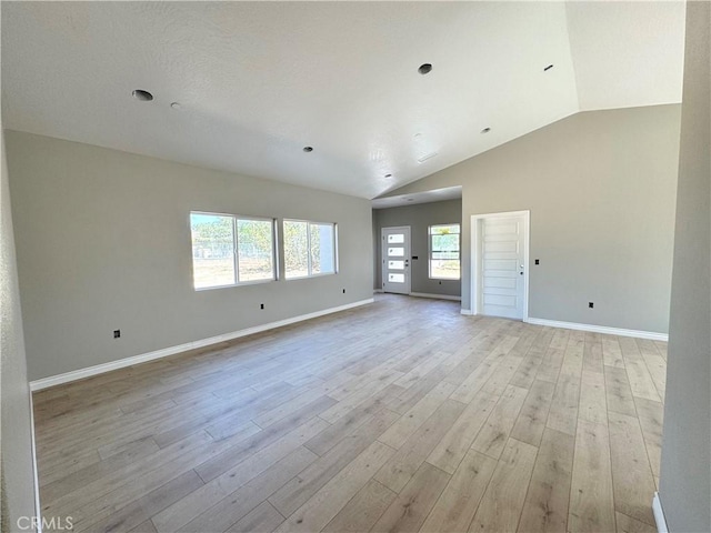 16063 Spruce St, Hesperia, CA 92345 - unfurnished room with light wood-style flooring, vaulted ceiling, and baseboards