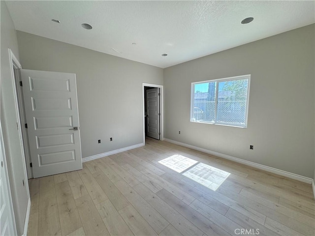 16063 Spruce St, Hesperia, CA 92345 - unfurnished bedroom with light wood-style floors and baseboards
