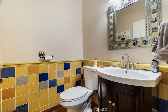 11576 Meridian Rd, Chico, CA 95973 - half bath with tile walls, toilet, wainscoting, and vanity