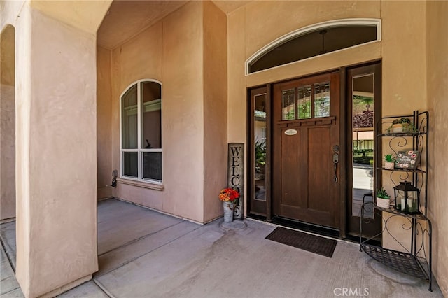 11576 Meridian Rd, Chico, CA 95973 - doorway to property with stucco siding and covered porch