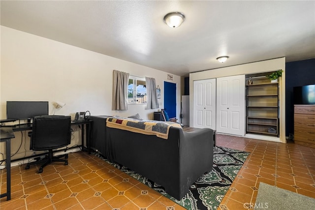 11576 Meridian Rd, Chico, CA 95973 - living room with a desk and dark tile patterned flooring