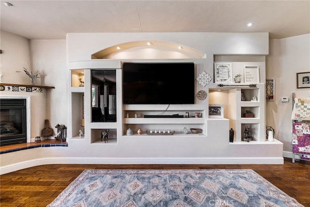 11576 Meridian Rd, Chico, CA 95973 - living area featuring wood finished floors, a glass covered fireplace, and recessed lighting