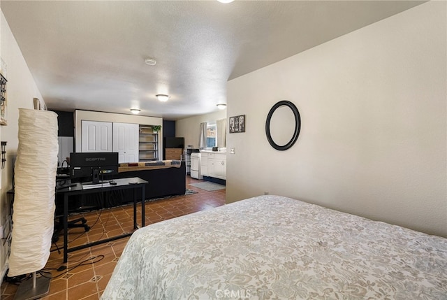11576 Meridian Rd, Chico, CA 95973 - bedroom featuring dark tile patterned flooring and an office area