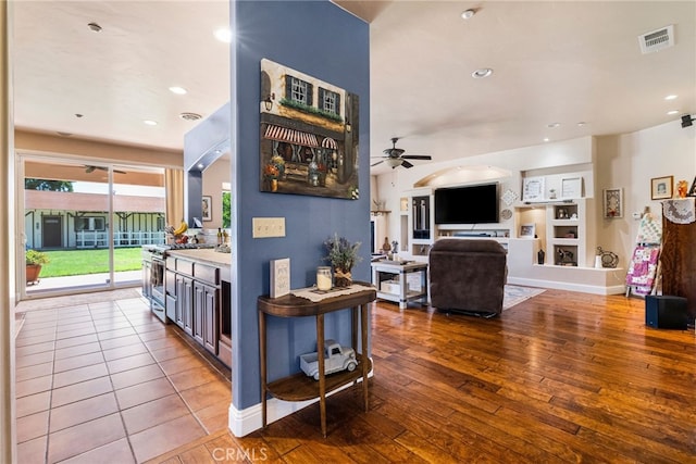 11576 Meridian Rd, Chico, CA 95973 - living area featuring ceiling fan, hardwood / wood-style floors, built in features, recessed lighting, and baseboards