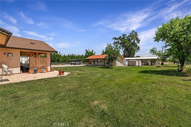 11576 Meridian Rd, Chico, CA 95973 - view of green lawn with a patio area